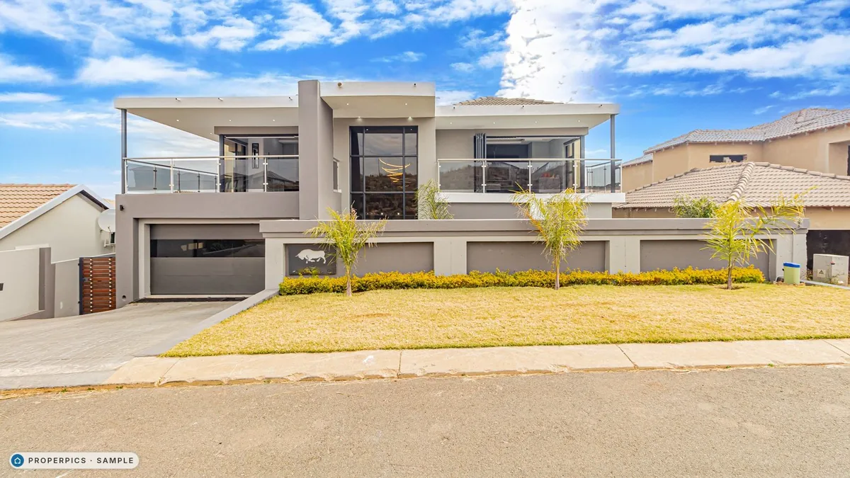 The front of the house photographed in daylight from the street