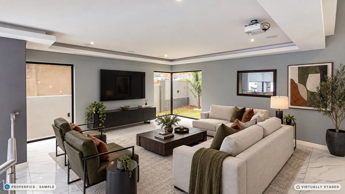 The same living room virtually staged in the Modern style by ProperPics, marked as virtually staged
