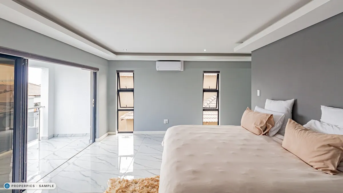 The main bedroom as photographed, with its existing furniture