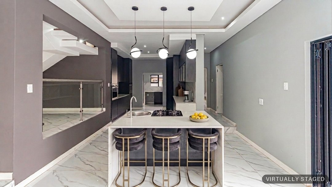 The same kitchen island dressed with seating and fresh fruit by ProperPics, marked as virtually staged