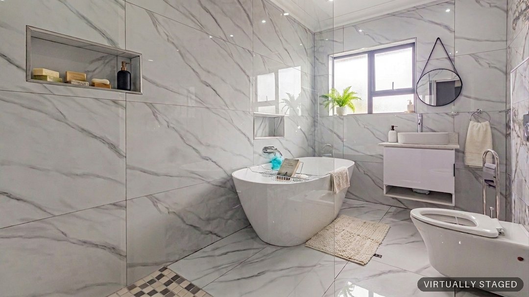 The same bathroom with towels, plants and styling added by ProperPics