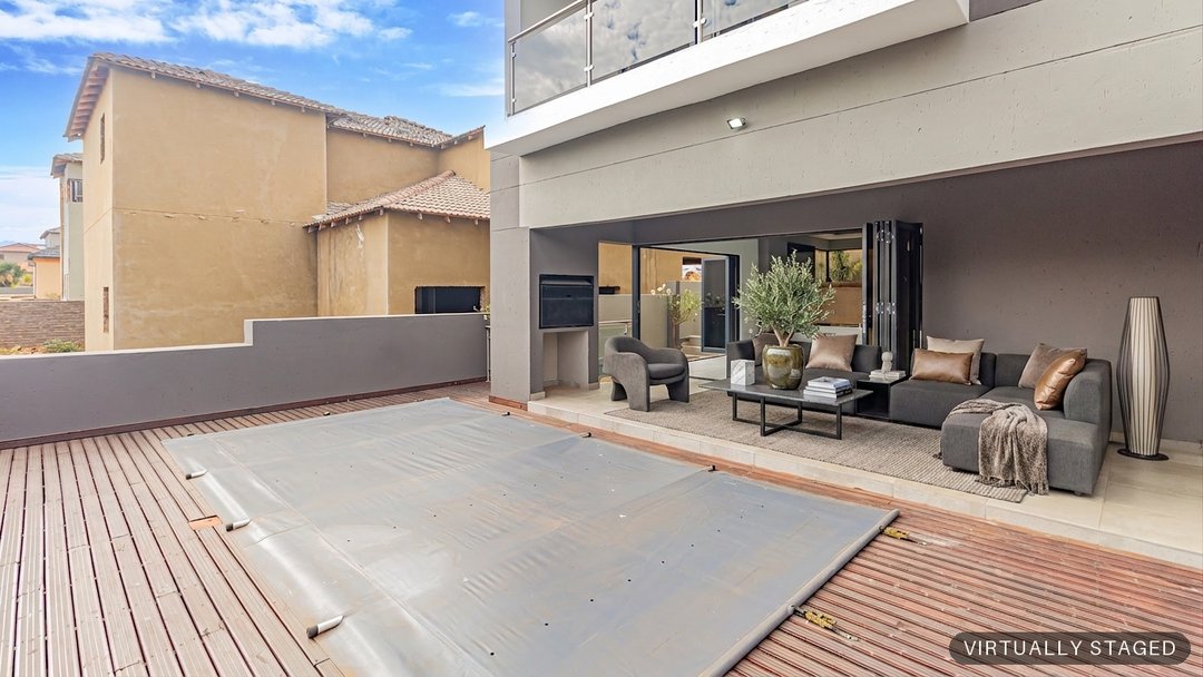 The same pool deck virtually staged with an outdoor lounge by ProperPics