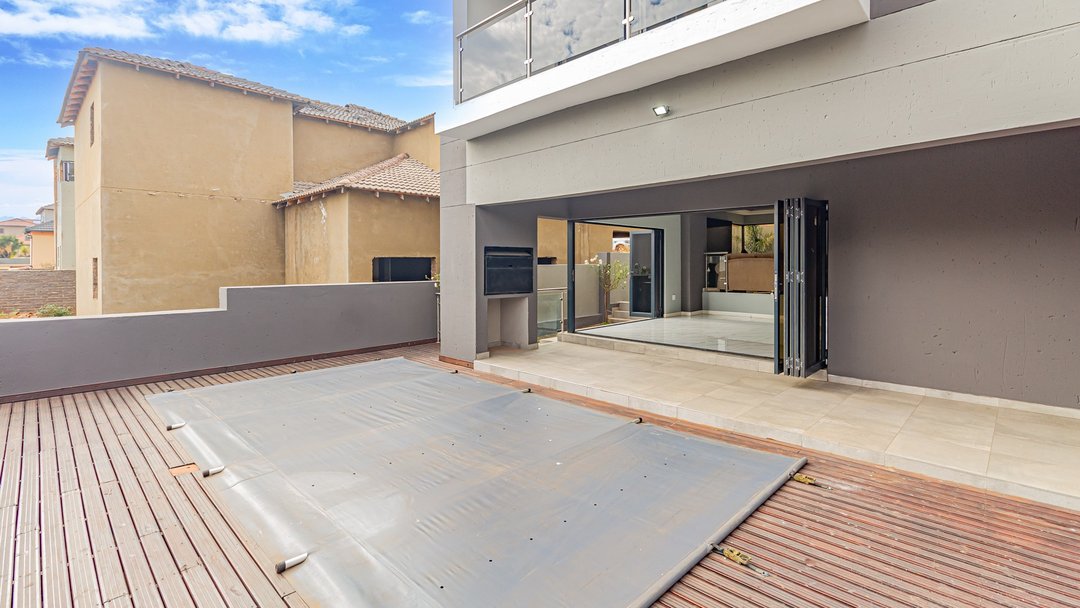 An empty pool deck, before staging