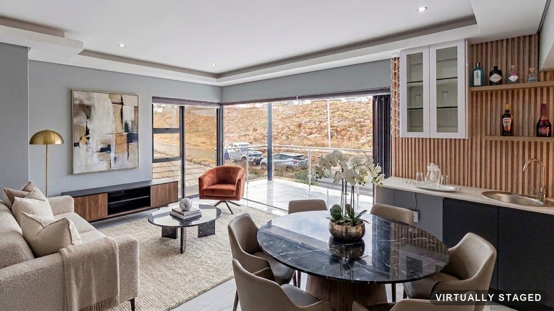 The same lounge cleared and virtually staged with a full lounge and dining corner by ProperPics