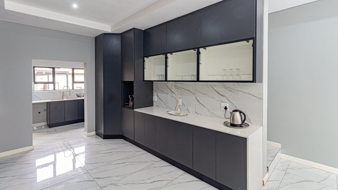 A scullery coffee corner with a lone kettle, before enhancement and styling