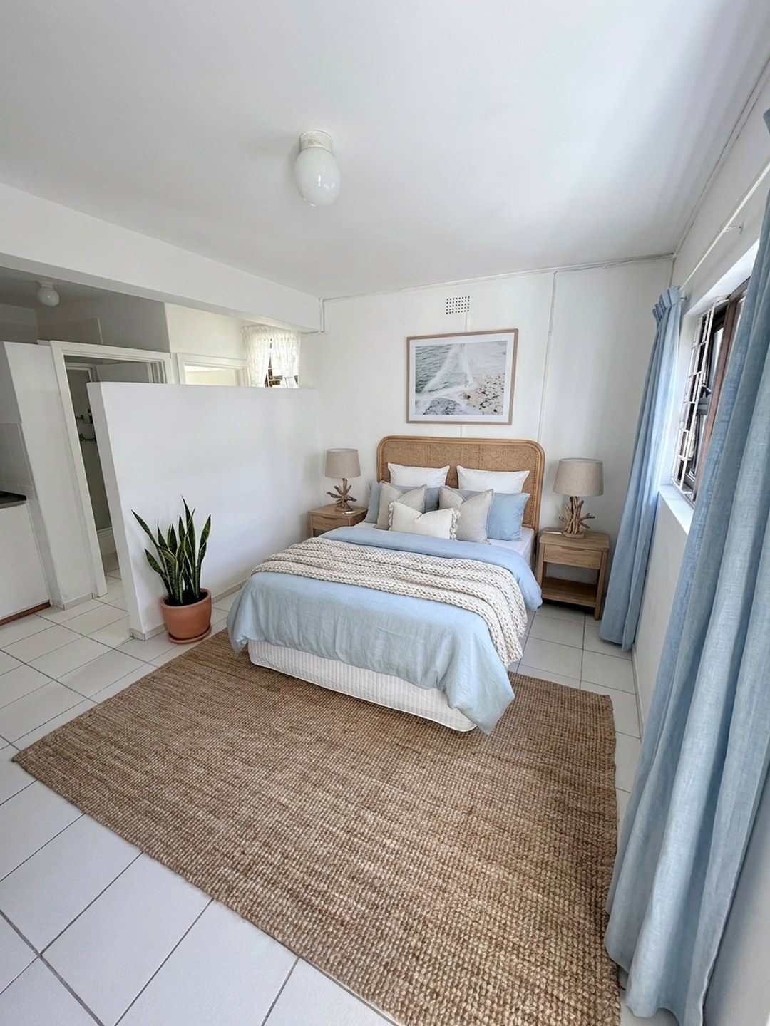 The same room cleared and virtually staged as a guest bedroom by ProperPics
