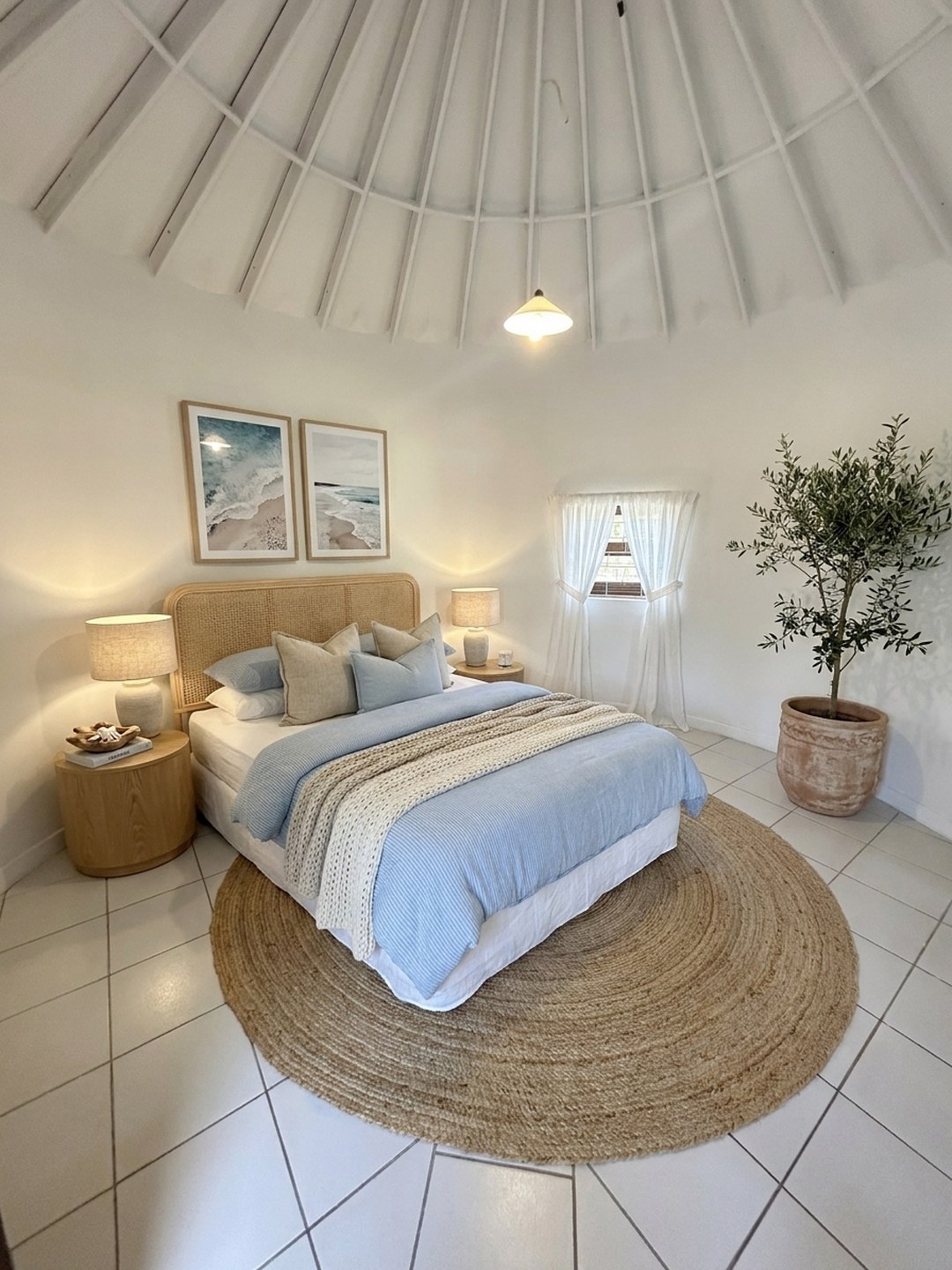 The same domed room cleared and virtually staged in coastal tones by ProperPics